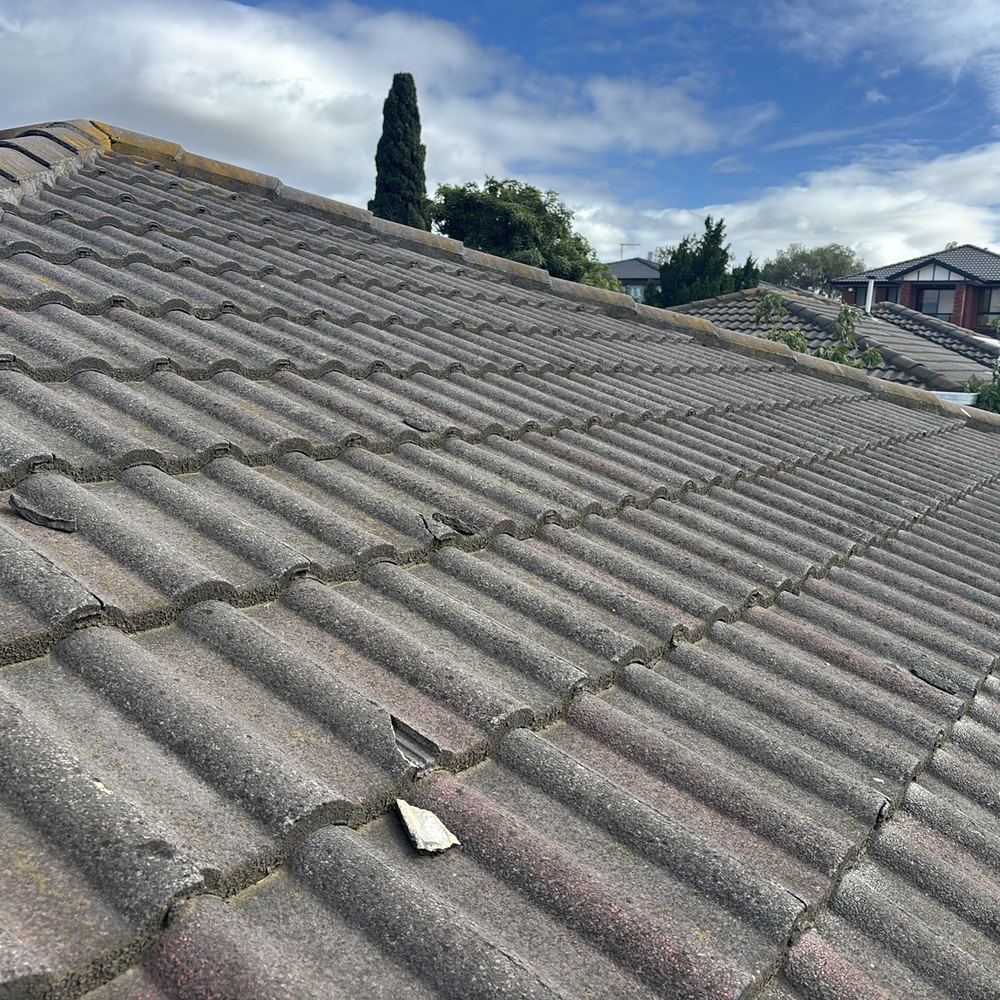 Cracked concrete roof tiles on an older home, found during a pre-purchase inspection in Braybrook