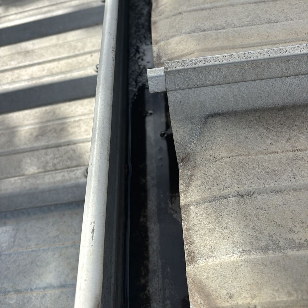 Gutter graded the wrong way, so water sits and spills, found during a pre-purchase inspection in Braybrook