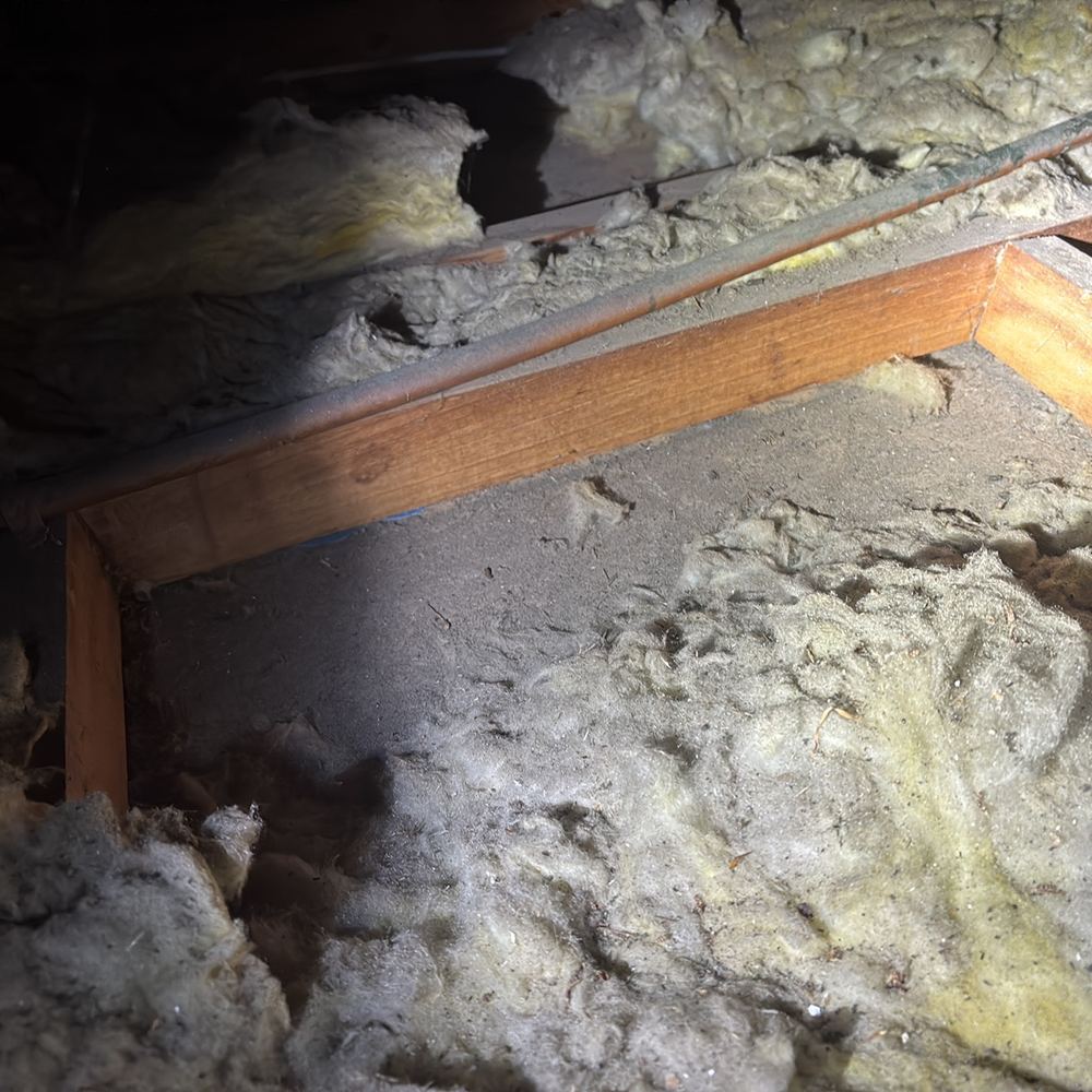 Ceiling insulation displaced in an older roof space, Braybrook, Manor Lakes