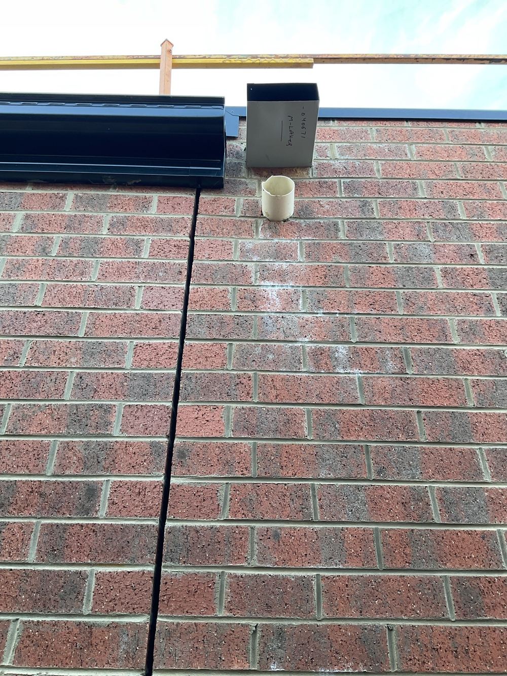 Box gutter overflow running into the rainhead instead of out to air, found during a fixing stage inspection in Manor Lakes