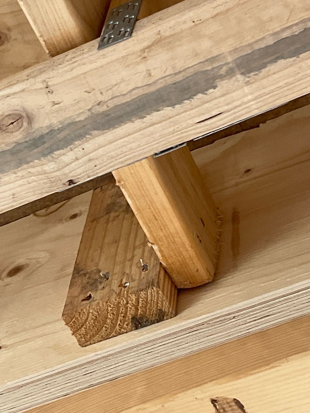 Framing anchors missing from a strongback in the upper floor structure, found during a frame stage inspection in Manor Lakes