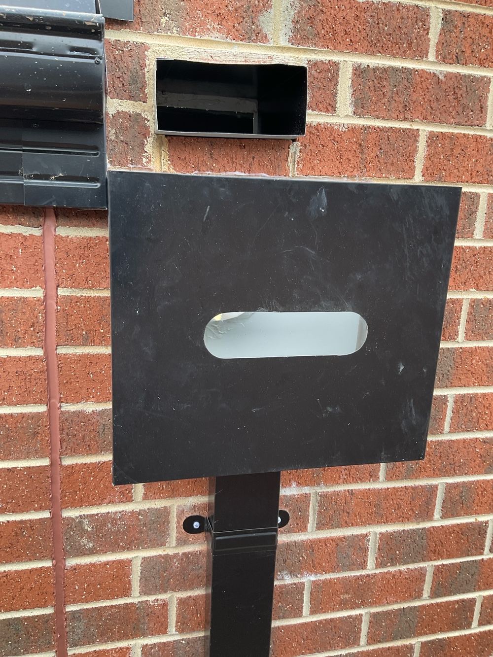 Box gutter overflow feeding the rainhead, so a blockage backs water up, found during a pre-handover (PCI) inspection in Manor Lakes