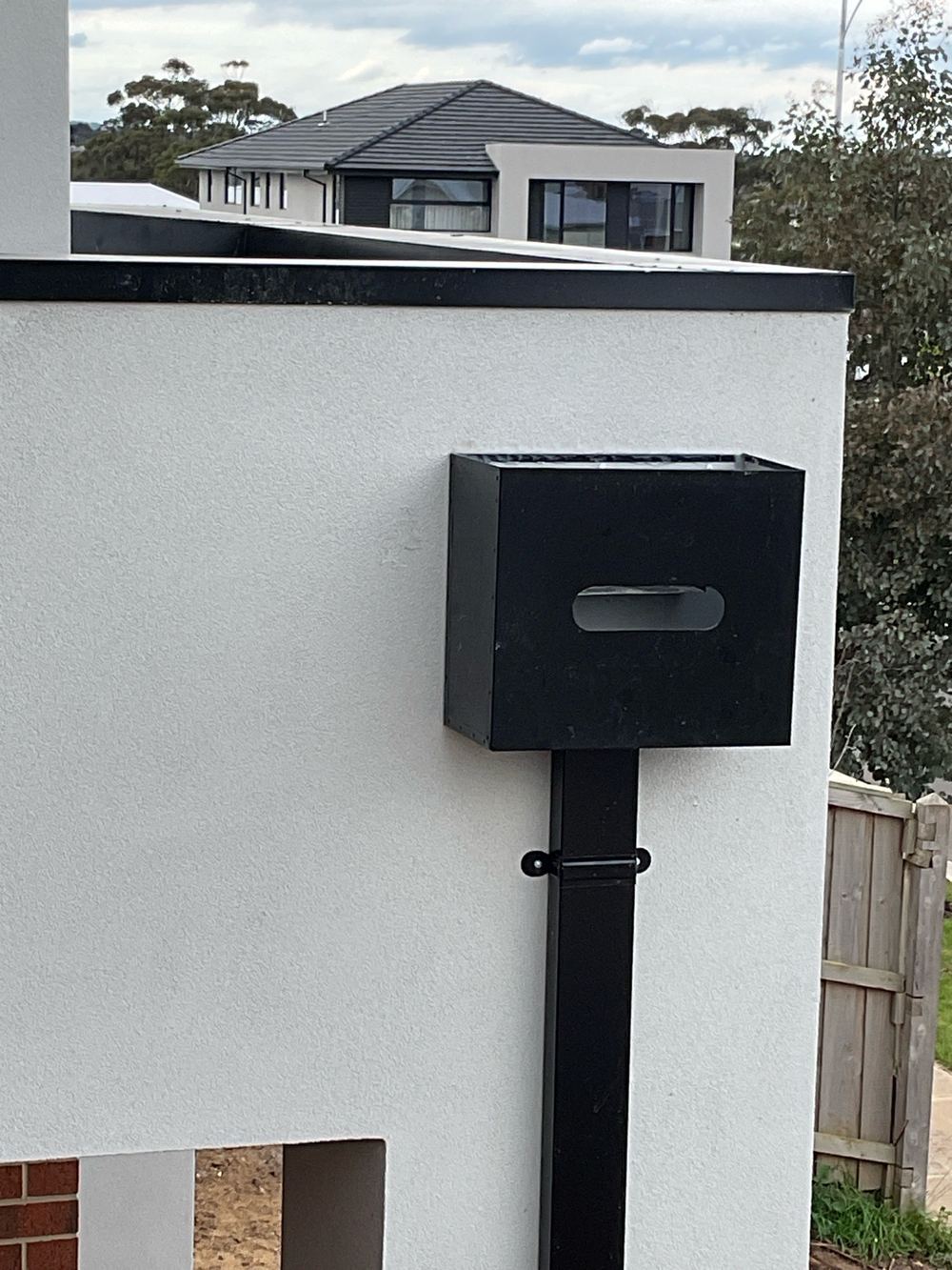 Rainhead relying on overflow slots that are not a deemed to satisfy method, found during a pre-handover (PCI) inspection in Manor Lakes