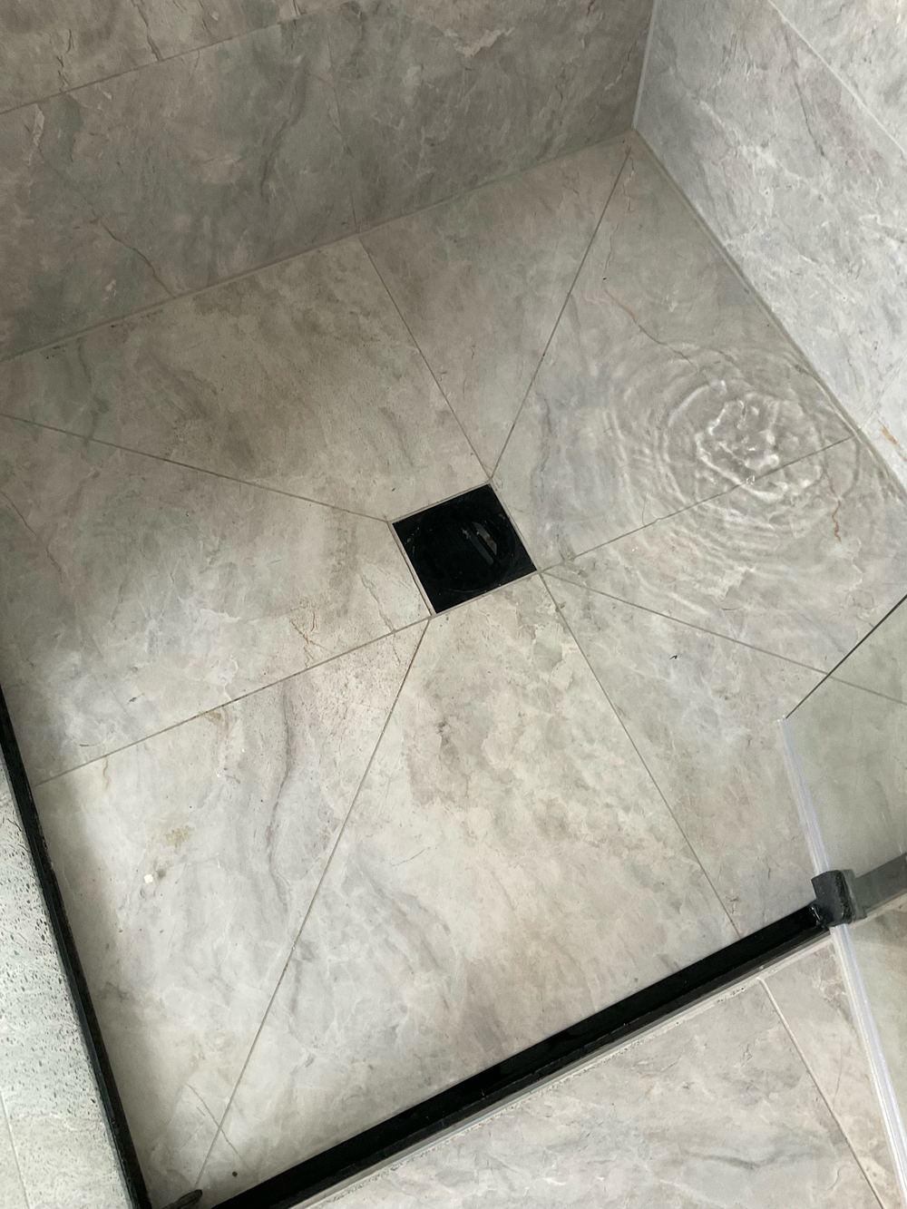 Water backing up at a shower waste while we ran the shower, found during a pre-handover (PCI) inspection in Manor Lakes