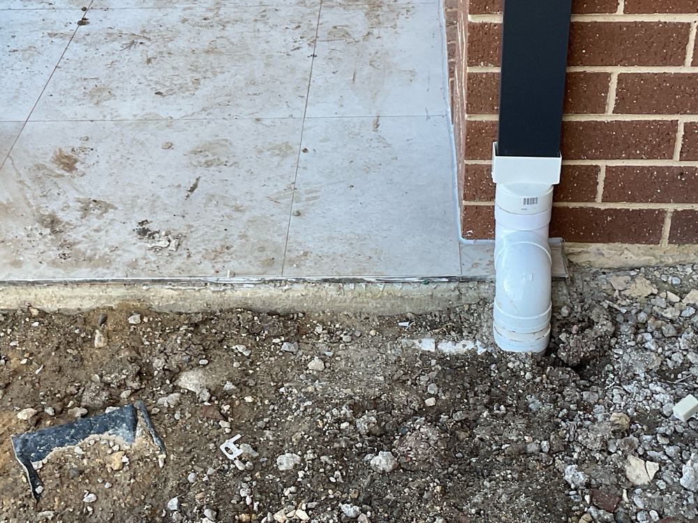 Stormwater pipe with too little soil over it to protect it, found during a pre-handover (PCI) inspection in Manor Lakes