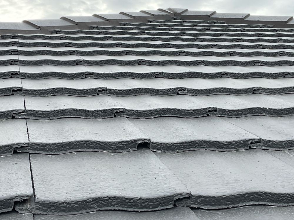 Broken tile underlap that will let water in during storms, Manor Lakes