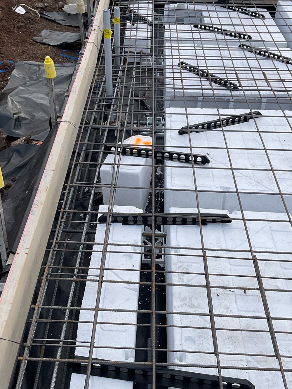 Beam narrower than the plans where pods had shifted without spacers, found during a slab pre-pour inspection in Manor Lakes